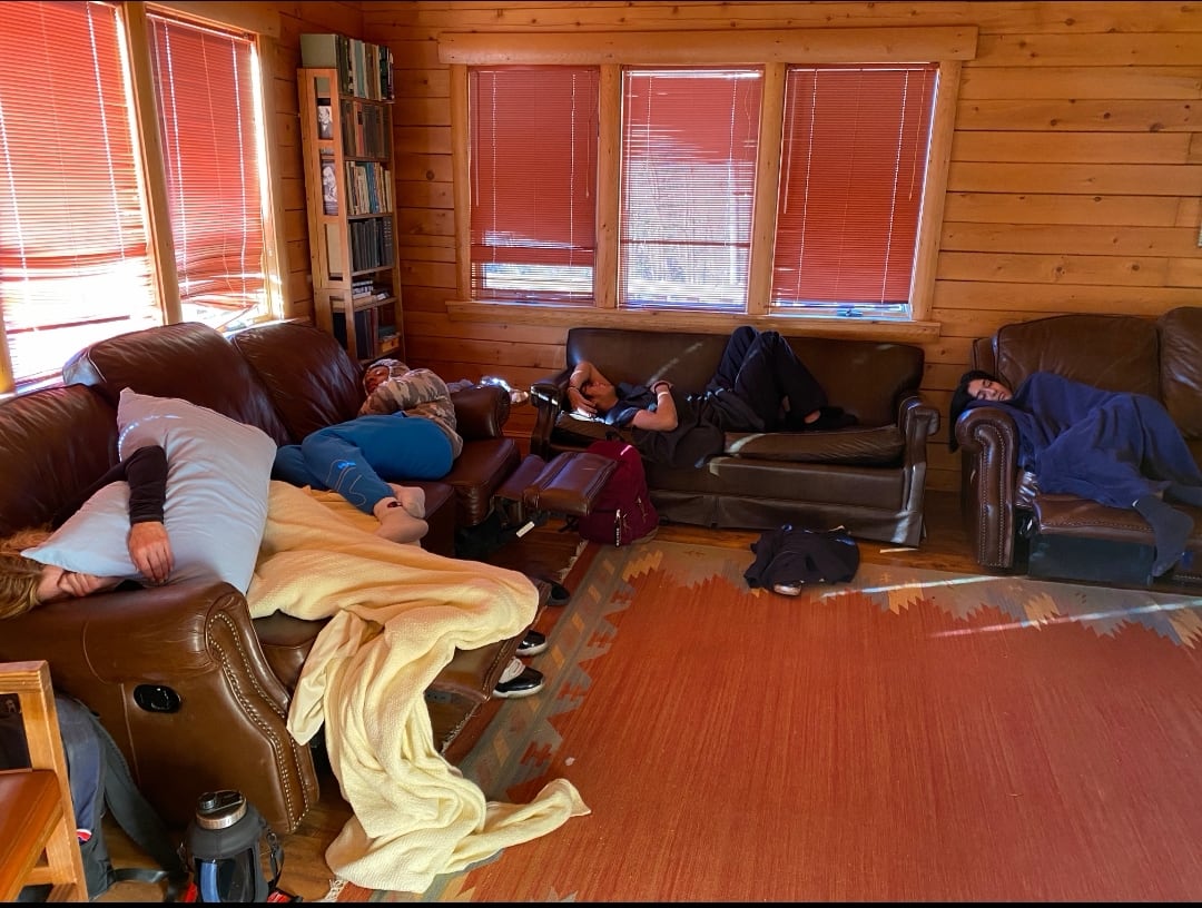 Friends relaxing together during a cabin trip