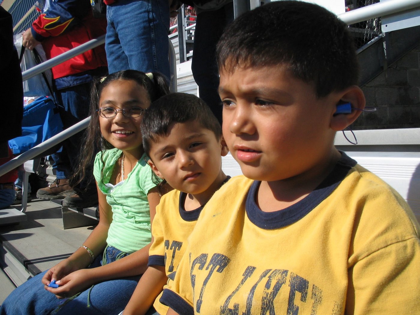 Children sitting together at a sporting event