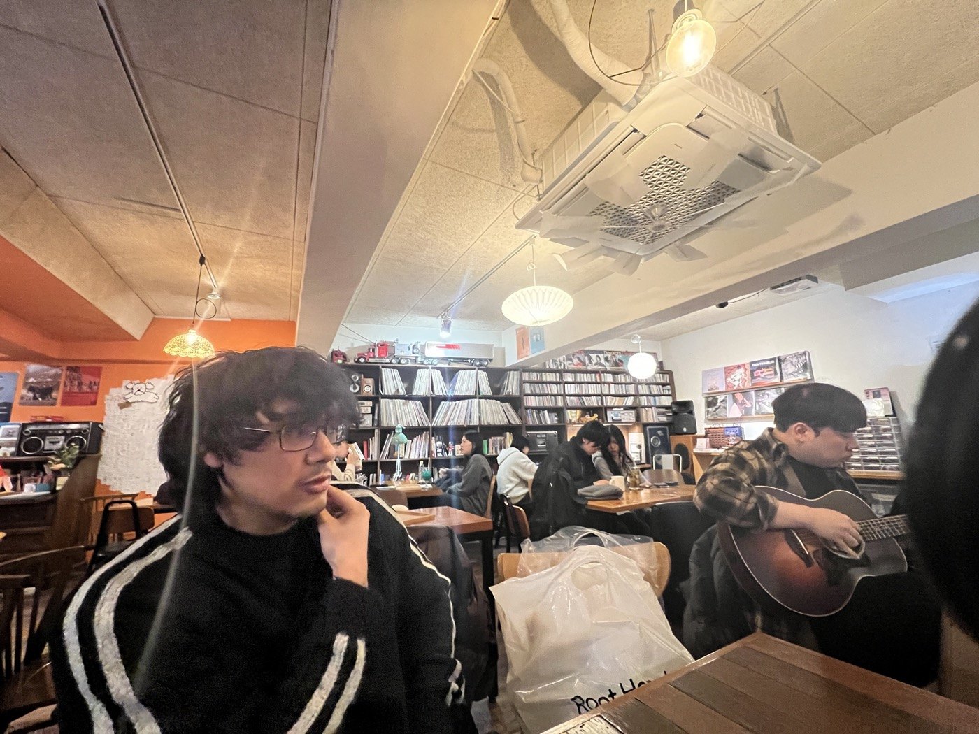 Friends sitting together inside a cafe