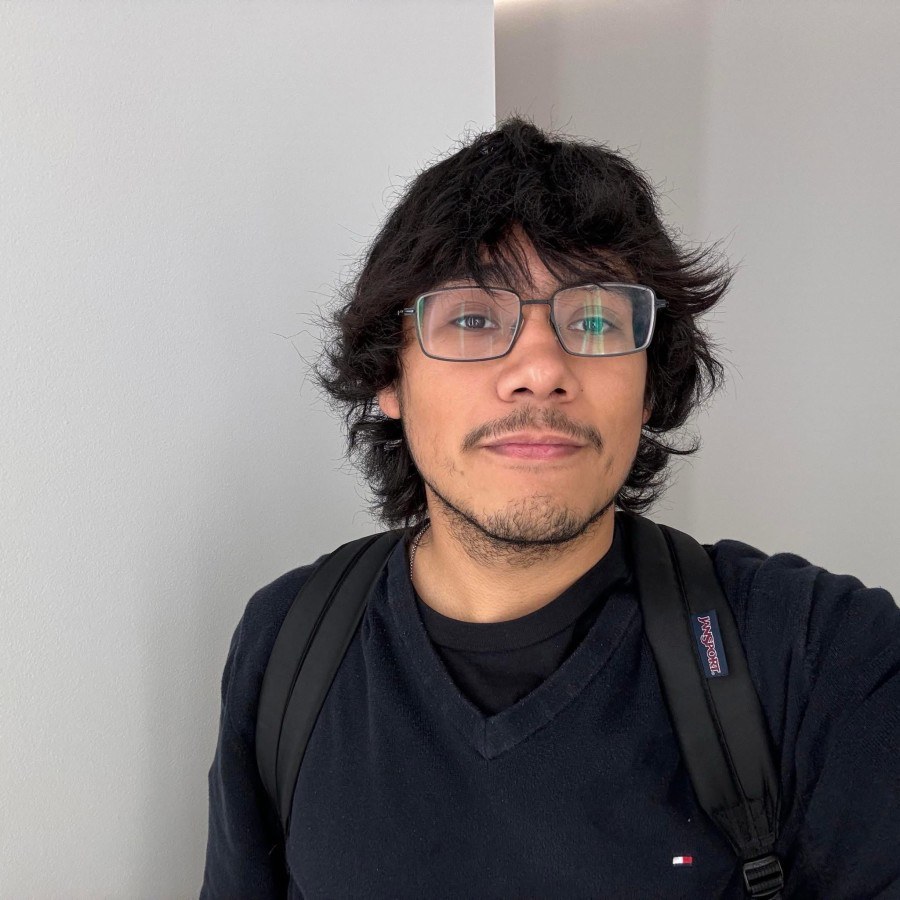 Erick’s longtime profile photo, with glasses, long hair, and a backpack