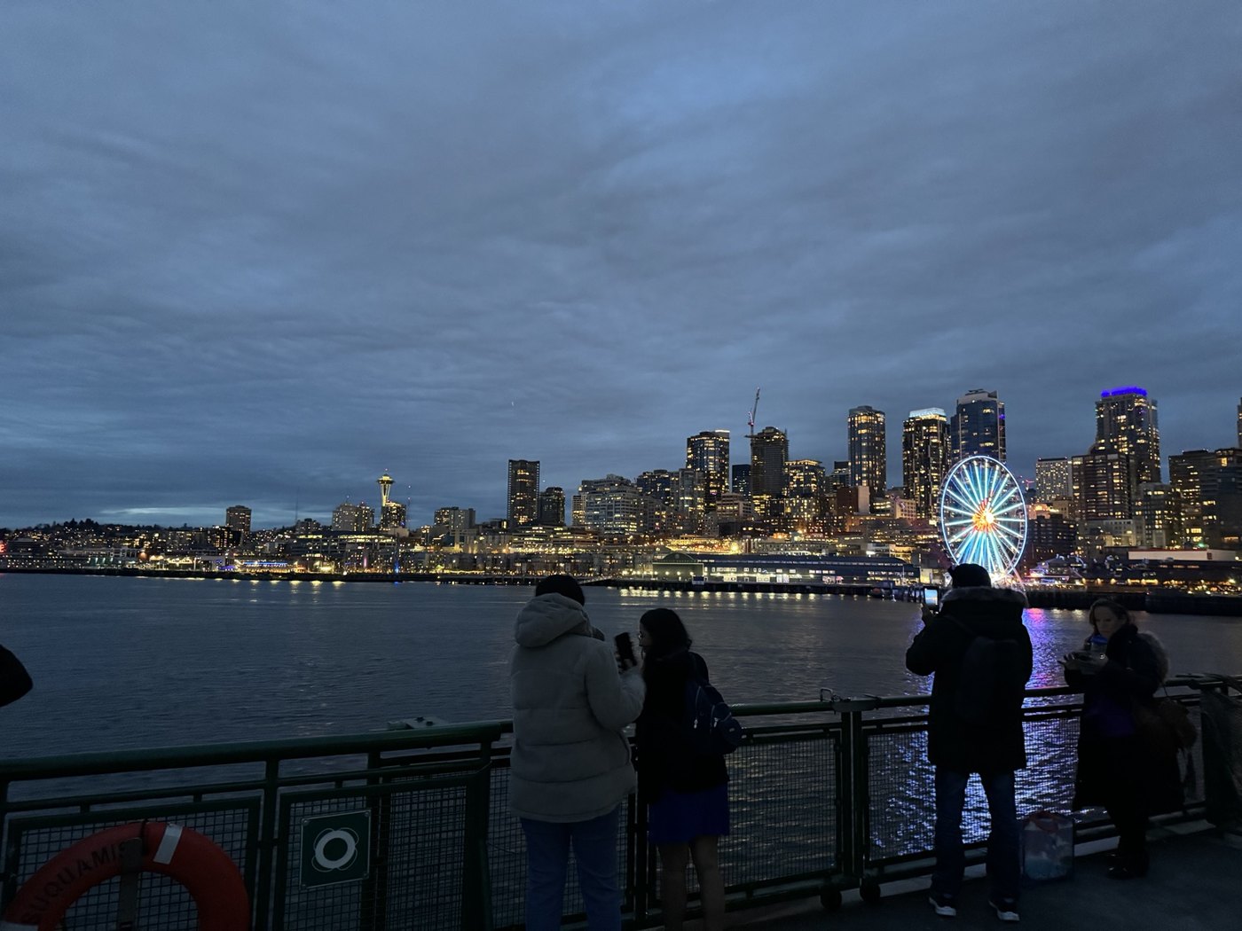 Seattle skyline and waterfront at blue hour with the Great Wheel lit up